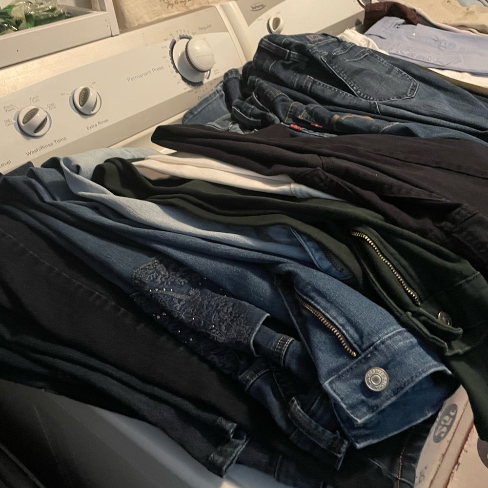 15 pairs jeans hardly worn, 8 pairs of shorts. Most are dark wash.